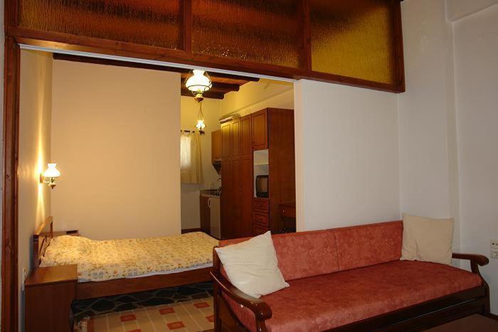 Postel nebo postele na pokoji v ubytování Guesthouse Ariadni
