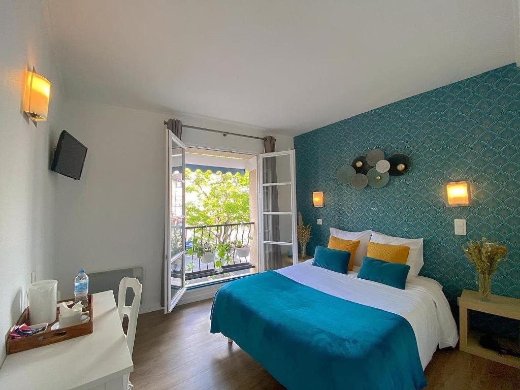 Postel nebo postele na pokoji v ubytování Hôtel Le Vauban