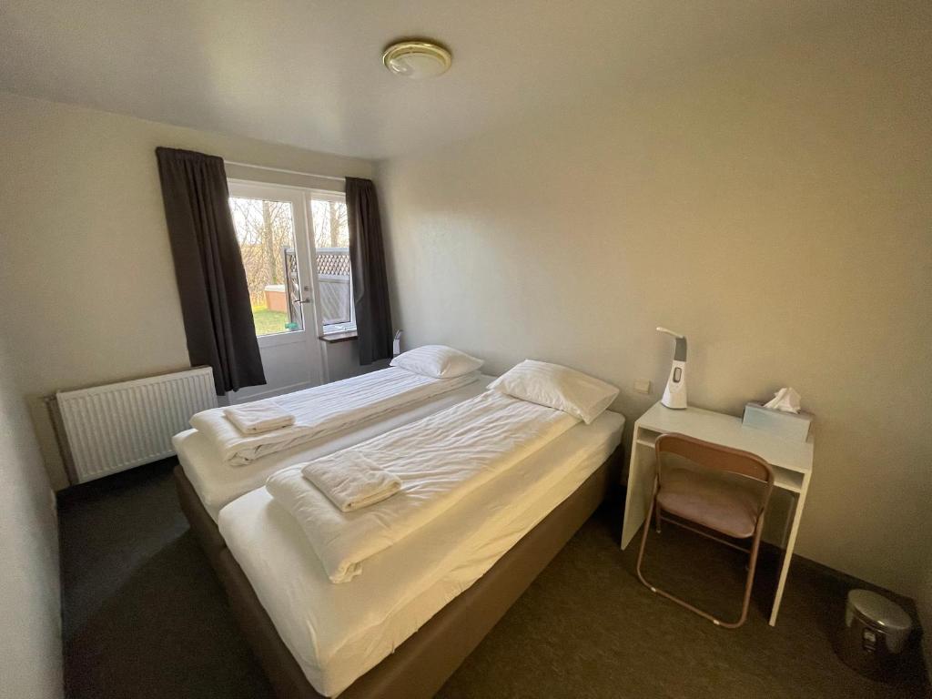 Postel nebo postele na pokoji v ubytování Guesthouse Bitra B&B