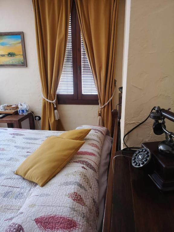 Postel nebo postele na pokoji v ubytování Hotel Triskel
