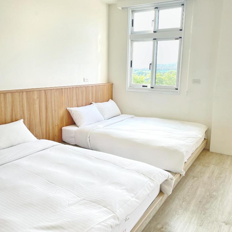Postel nebo postele na pokoji v ubytování Pomelo Homestay