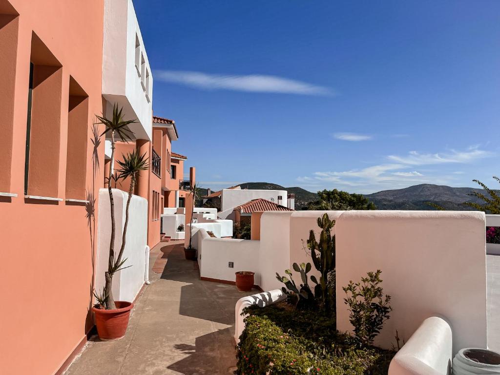 a view of a street with white buildings and plants at Nisea Hotel Samos in Pythagoreio