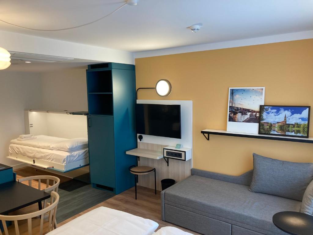 TV a/nebo společenská místnost v ubytování Aparthotel Adagio access Hamburg