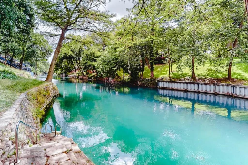 a river in a park with blue water at Restful River Retreat in New Braunfels