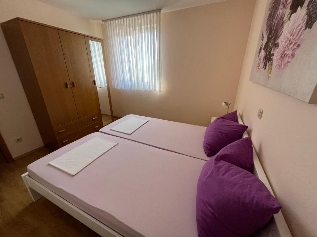 Posteľ alebo postele v izbe v ubytovaní Apartmani Emil