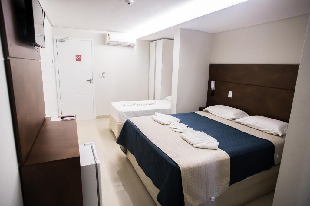 Postel nebo postele na pokoji v ubytování Pousada Orla dos Corais
