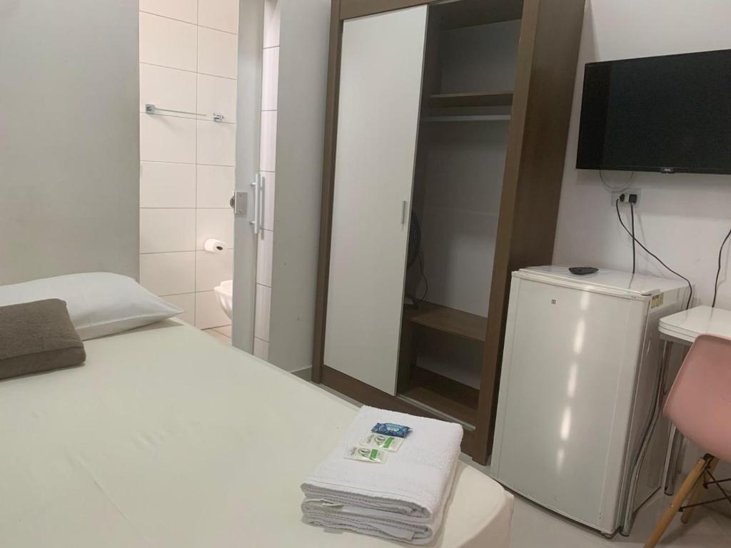 Postel nebo postele na pokoji v ubytování Pousada Internacional EAS 10min Aeroporto