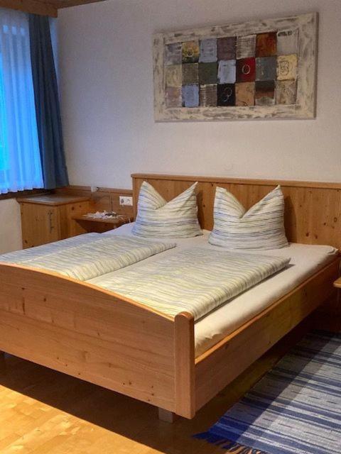 Postel nebo postele na pokoji v ubytování Pension & Ferienwohnung Dullnig