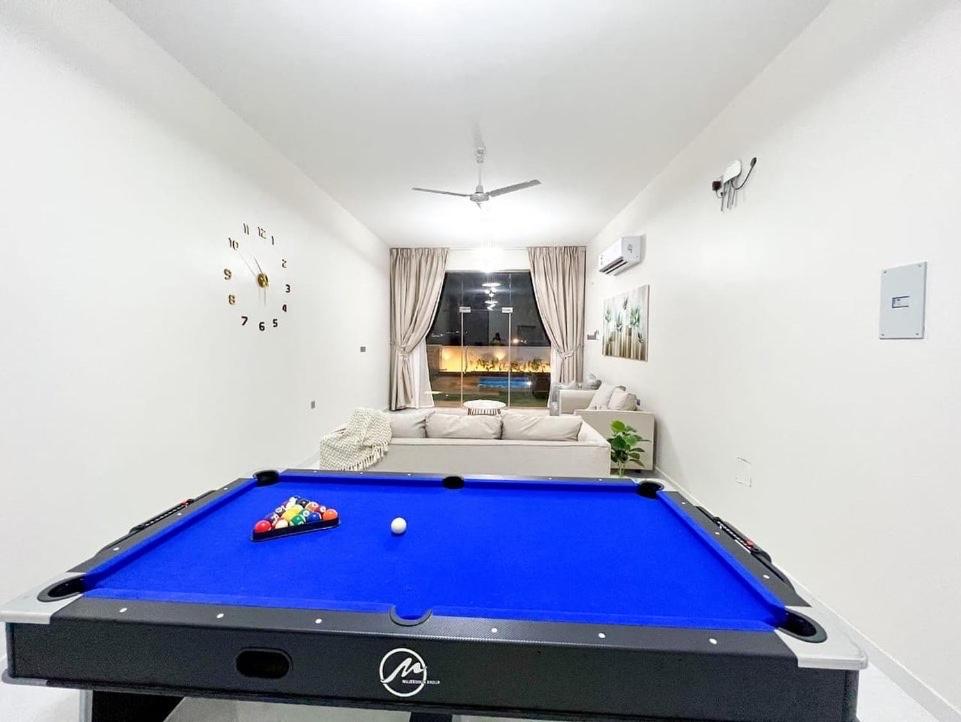 a living room with a large blue pool table at alsaif camp in Bidiyah