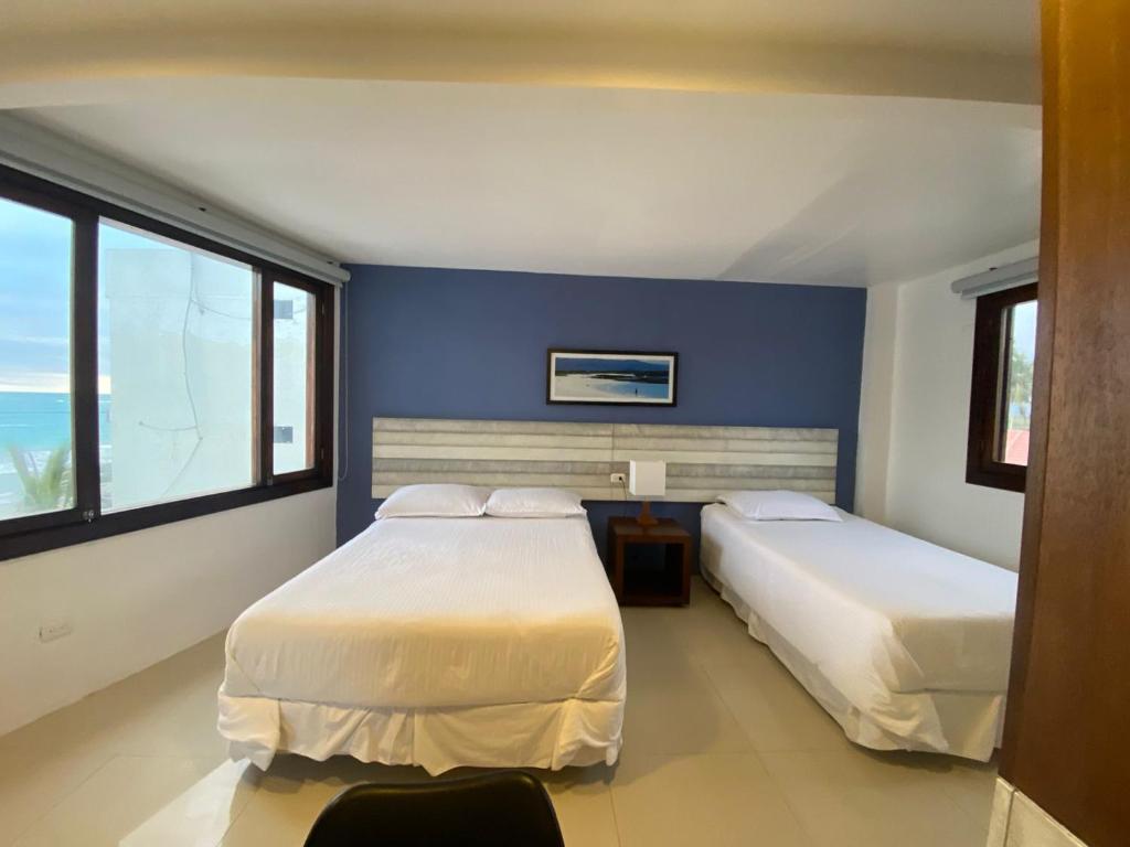 Postel nebo postele na pokoji v ubytování Casita de la Playa