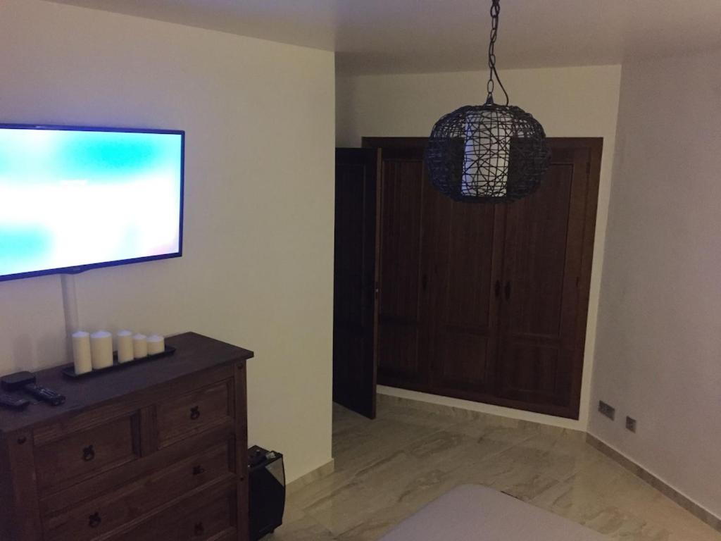 A television and/or entertainment centre at Panorama Park, Punta Prima, 5 star Luxury 2 bedroom Apartment like no other