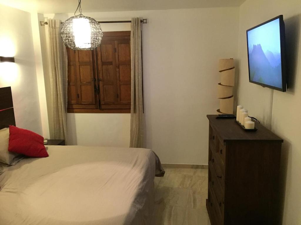 A television and/or entertainment centre at Panorama Park, Punta Prima, 5 star Luxury 2 bedroom Apartment like no other