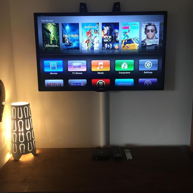A television and/or entertainment centre at Panorama Park, Punta Prima, 5 star Luxury 2 bedroom Apartment like no other