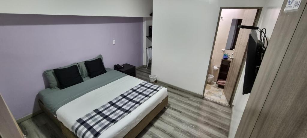 Postel nebo postele na pokoji v ubytování Stay Blue Hotel