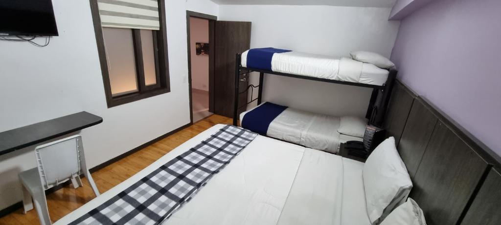 Postel nebo postele na pokoji v ubytování Stay Blue Hotel