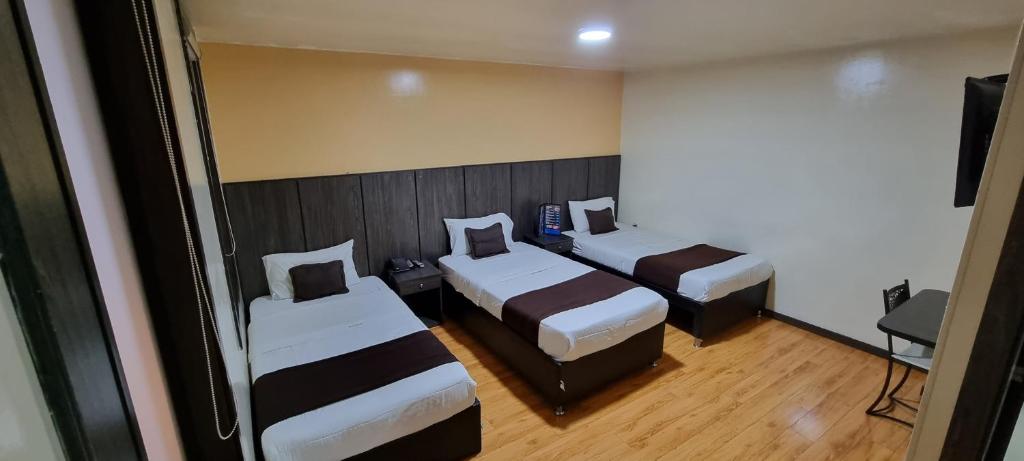 Postel nebo postele na pokoji v ubytování Stay Blue Hotel