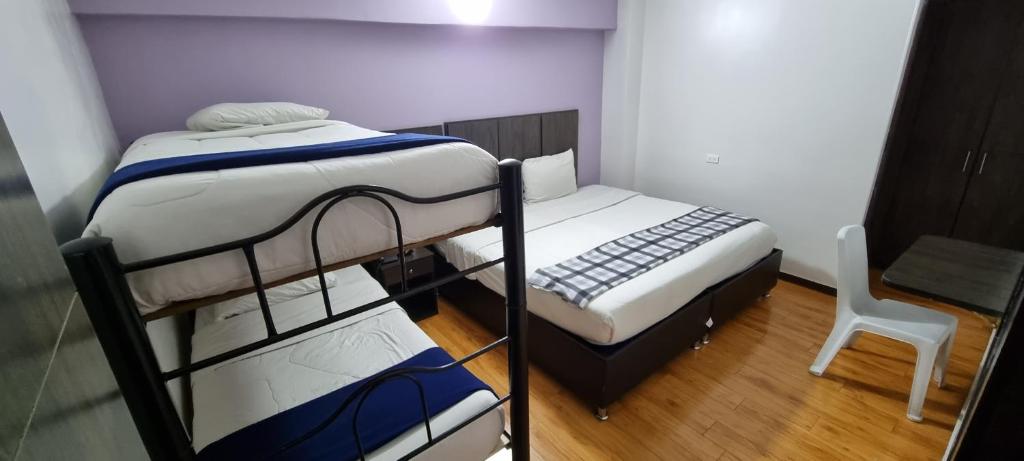 Postel nebo postele na pokoji v ubytování Stay Blue Hotel