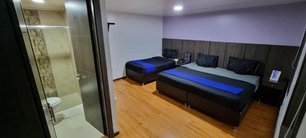 Postel nebo postele na pokoji v ubytování Stay Blue Hotel
