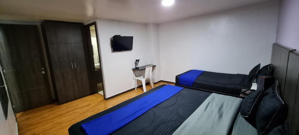 TV a/nebo společenská místnost v ubytování Stay Blue Hotel