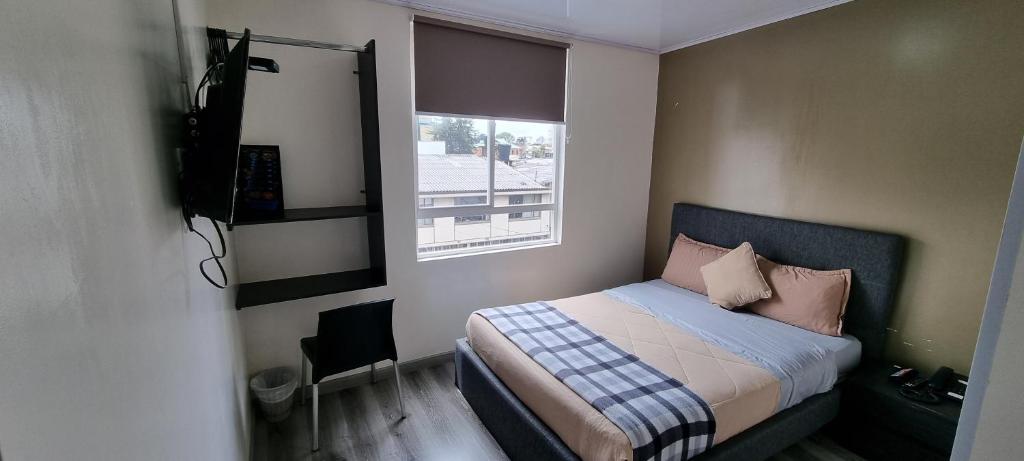Postel nebo postele na pokoji v ubytování Stay Blue Hotel