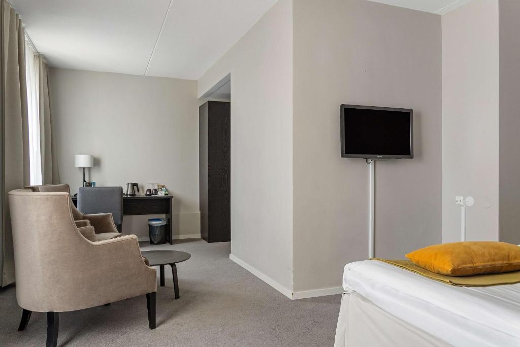 TV a/nebo společenská místnost v ubytování Best Western Plus Hotel Plaza