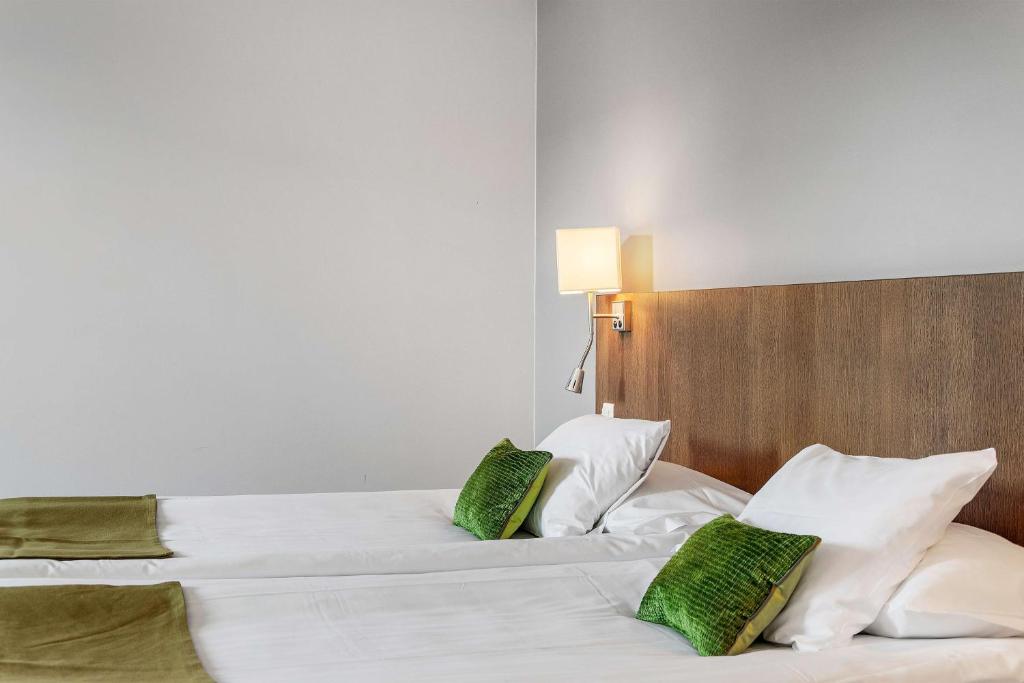 Postel nebo postele na pokoji v ubytování Best Western Plus Hotel Plaza