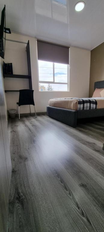 Postel nebo postele na pokoji v ubytování Stay Blue Hotel