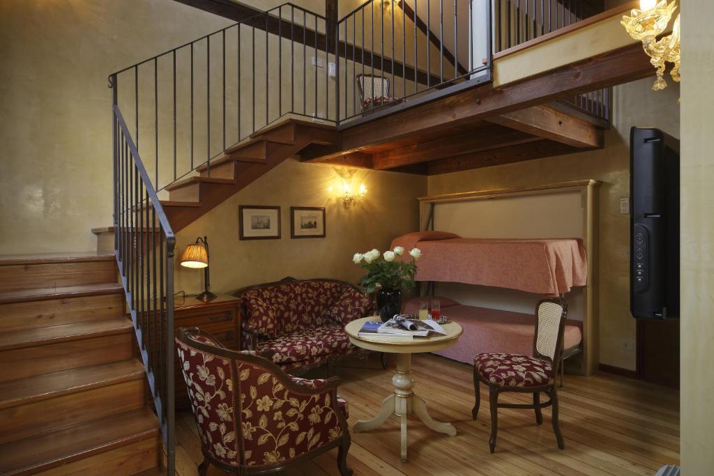 Postel nebo postele na pokoji v ubytování Hotel Bisanzio