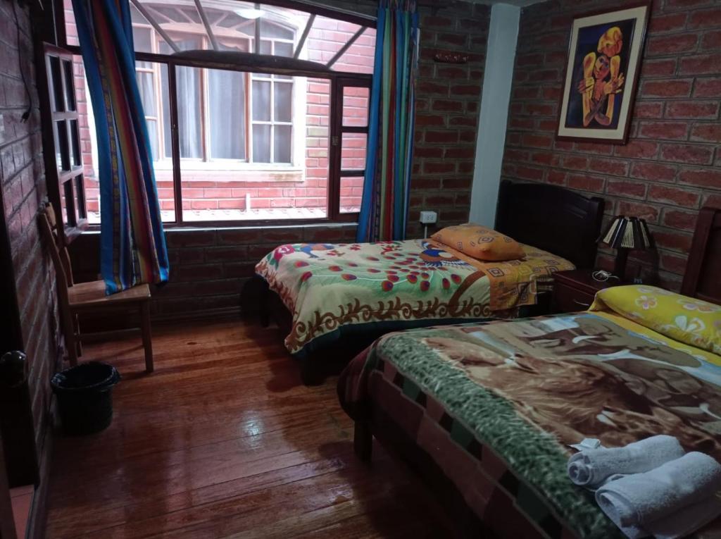 Postel nebo postele na pokoji v ubytování Hostal D´Mathias