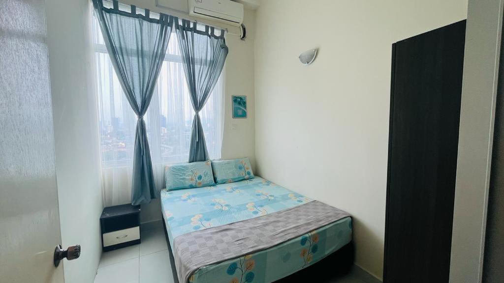 a small bed in a room with a window at VUE RESIDENCES Jln Pahang, KL city - 2 ROOM in Kuala Lumpur