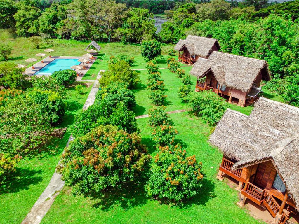 an aerial view of a house with a garden at Sigiriya Water Cottage in Sigiriya