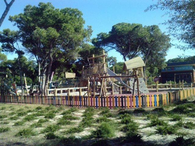 a playground with a slide in a park at Hotel Residencial Colibri in Costa da Caparica
