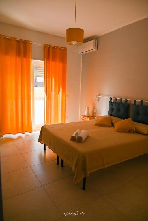 Łóżko lub łóżka w pokoju w obiekcie Casa Vacanza Le Dune - Mare