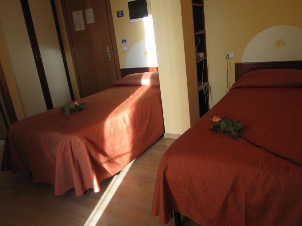 Postel nebo postele na pokoji v ubytování Hotel Al Sole - ENJOY HOLIDAY