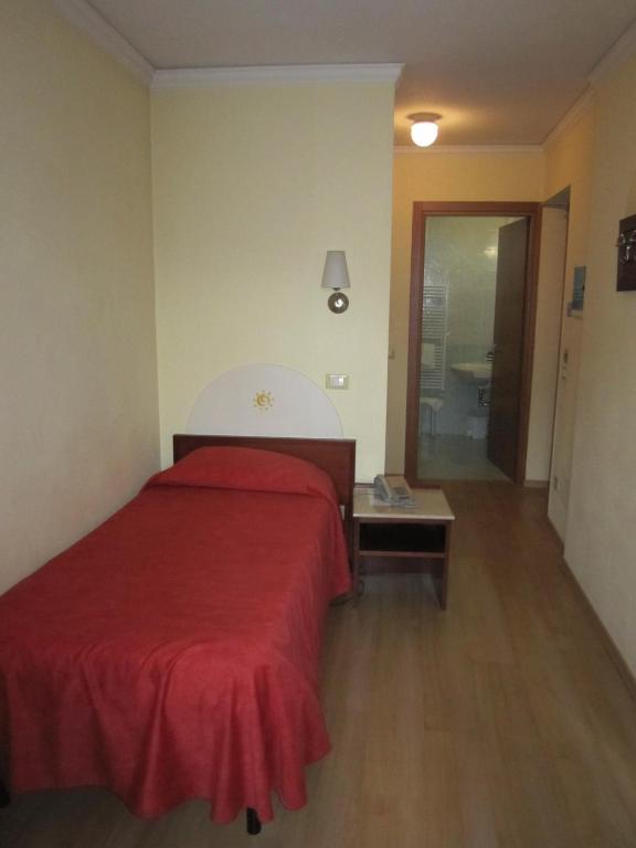 Postel nebo postele na pokoji v ubytování Hotel Al Sole - ENJOY HOLIDAY