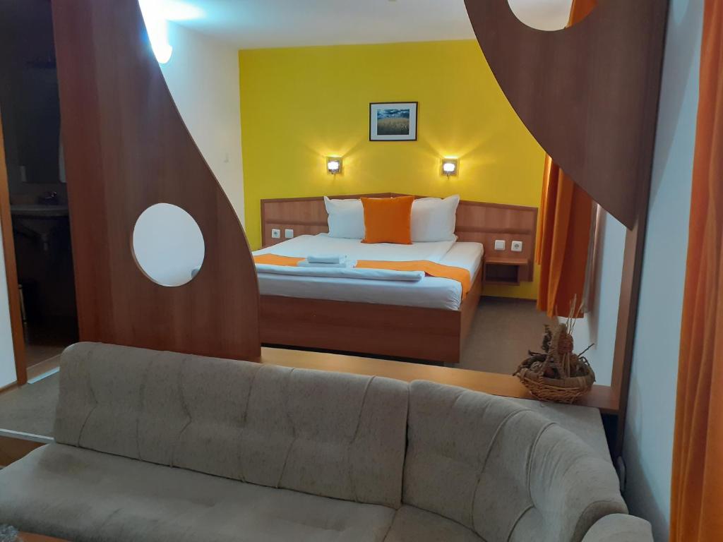 Postel nebo postele na pokoji v ubytování Hotel Les