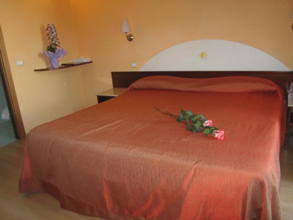 Postel nebo postele na pokoji v ubytování Hotel Al Sole - ENJOY HOLIDAY