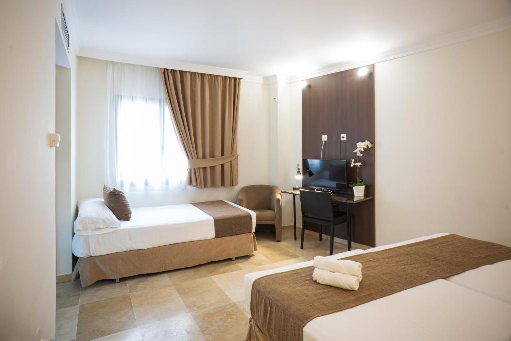 Postel nebo postele na pokoji v ubytování Mainake Costa del Sol