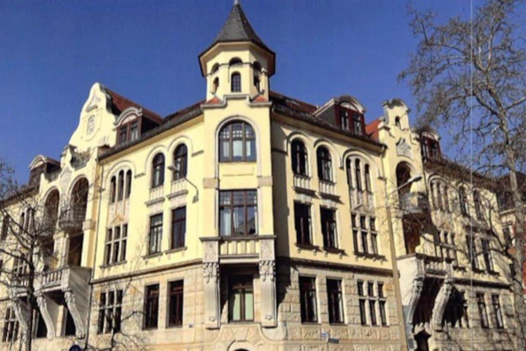 a large building with a tower on top of it at Traumhafte Wohnung im Herzen von Leipzig in Leipzig