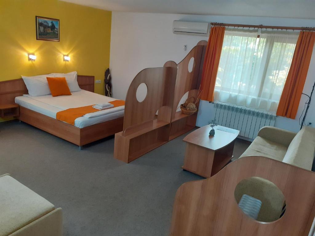Postel nebo postele na pokoji v ubytování Hotel Les