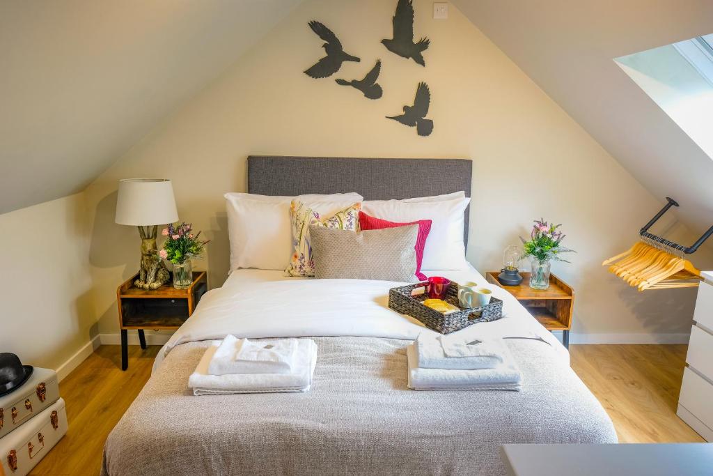 a bedroom with a bed with bats on the wall at Ditton Fields by condokeeper in Chesterton