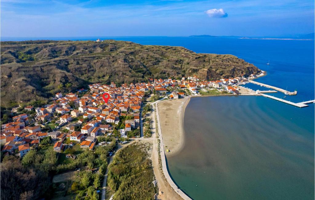 an aerial view of a village on a hill next to the water at Stunning Home In Susak With Kitchen in Susak