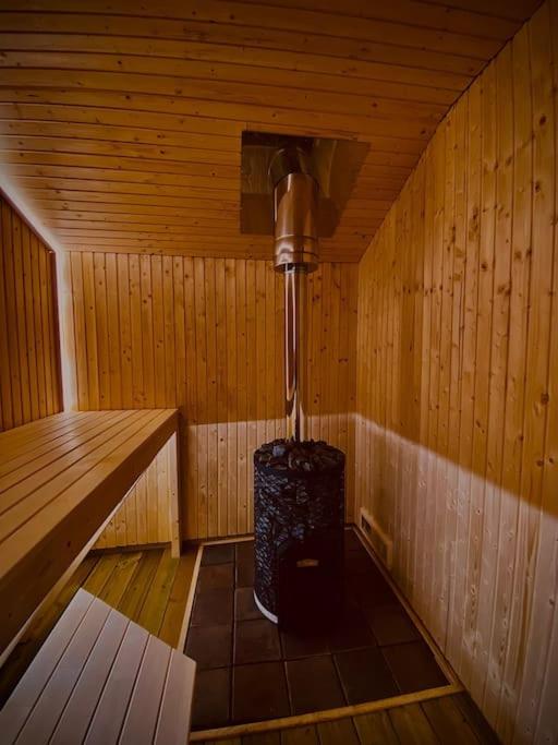 a inside of a sauna with a suitcase in it at StugaNäraKungsberget - mysig stuga med kamin, grillkåta och vedbastu in Ockelbo