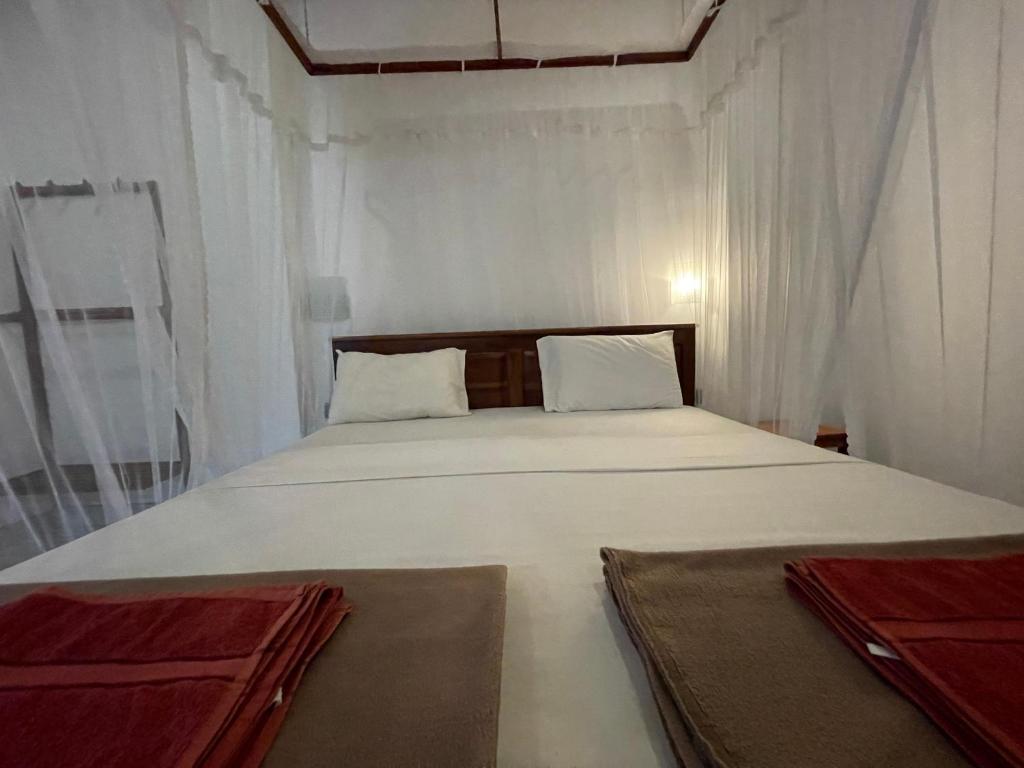 Postel nebo postele na pokoji v ubytování Jade Green Rest Inn