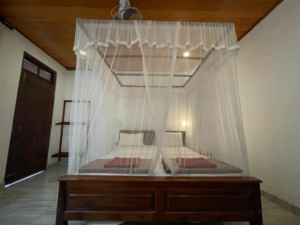 Postel nebo postele na pokoji v ubytování Jade Green Rest Inn