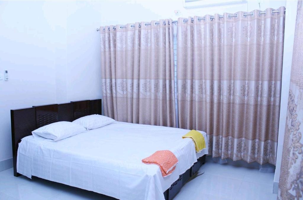 Katil atau katil-katil dalam bilik di Appolo Dhaka Stay for 2 Person