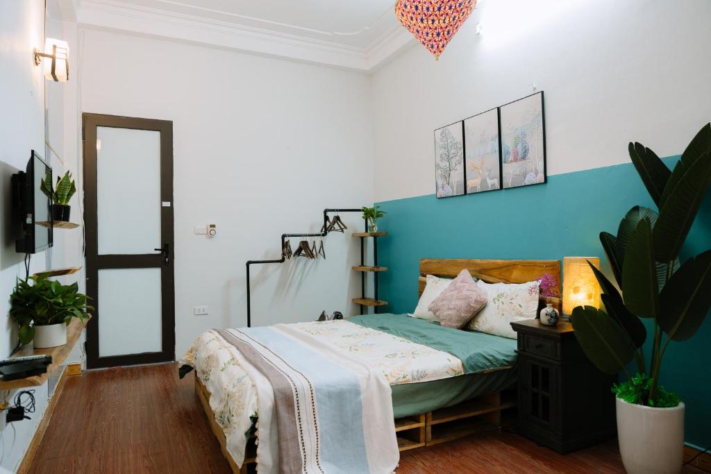 Postel nebo postele na pokoji v ubytování Hanoi Hola House