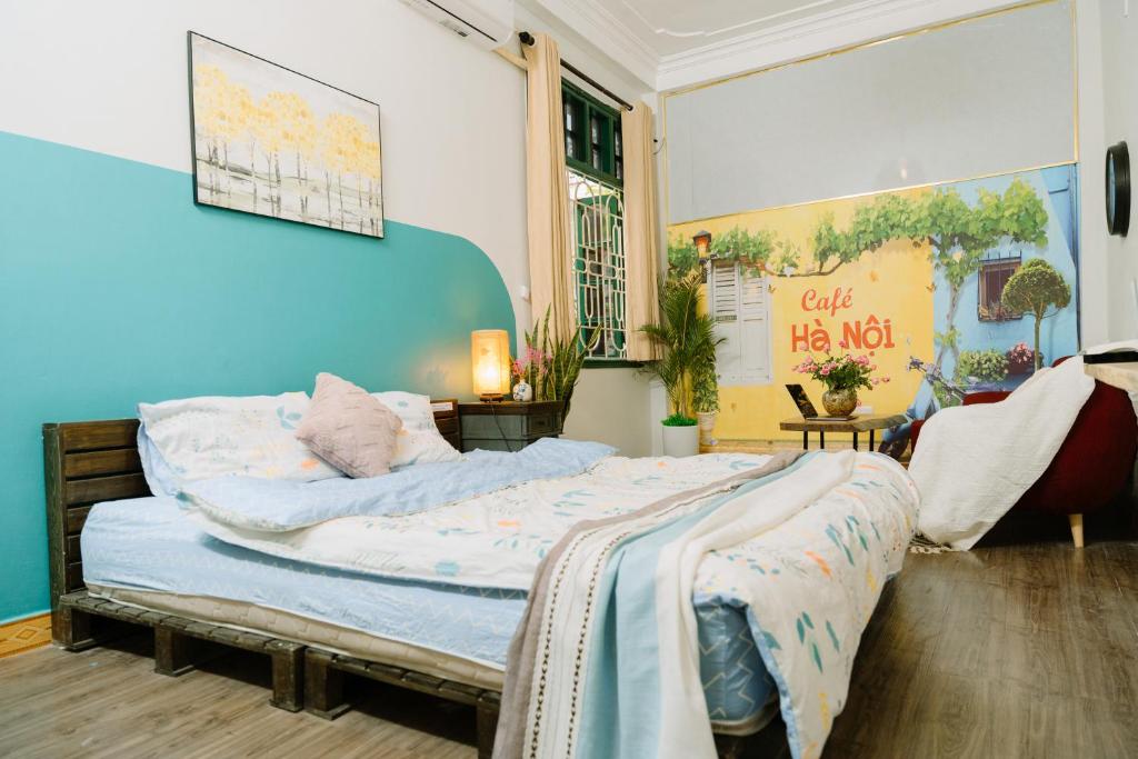 Postel nebo postele na pokoji v ubytování Hanoi Hola House