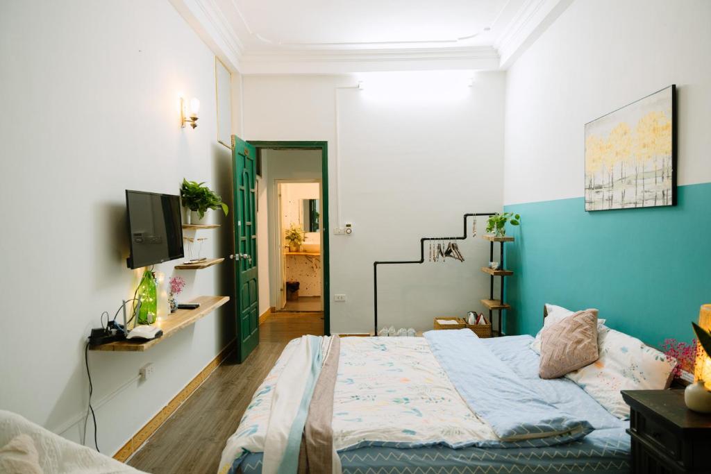 Postel nebo postele na pokoji v ubytování Hanoi Hola House
