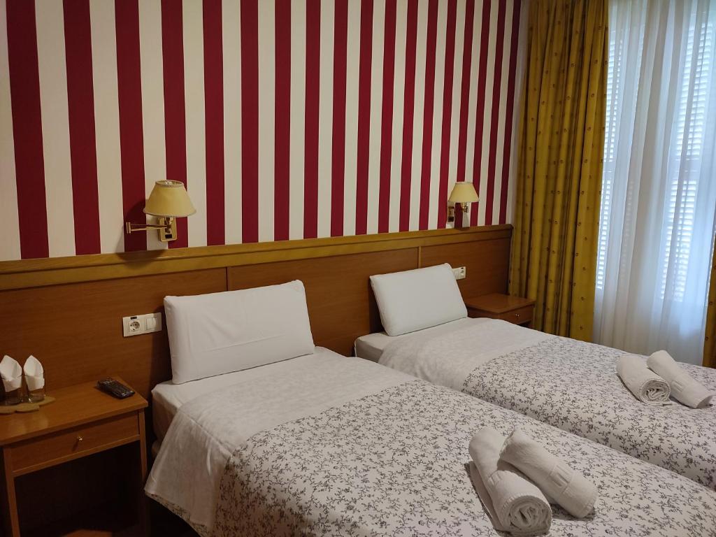 Postel nebo postele na pokoji v ubytování Hostal Salomé